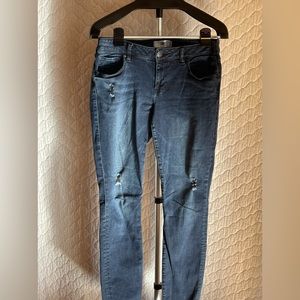 Size 8 CAbi distressed dark wash skinny jeans
